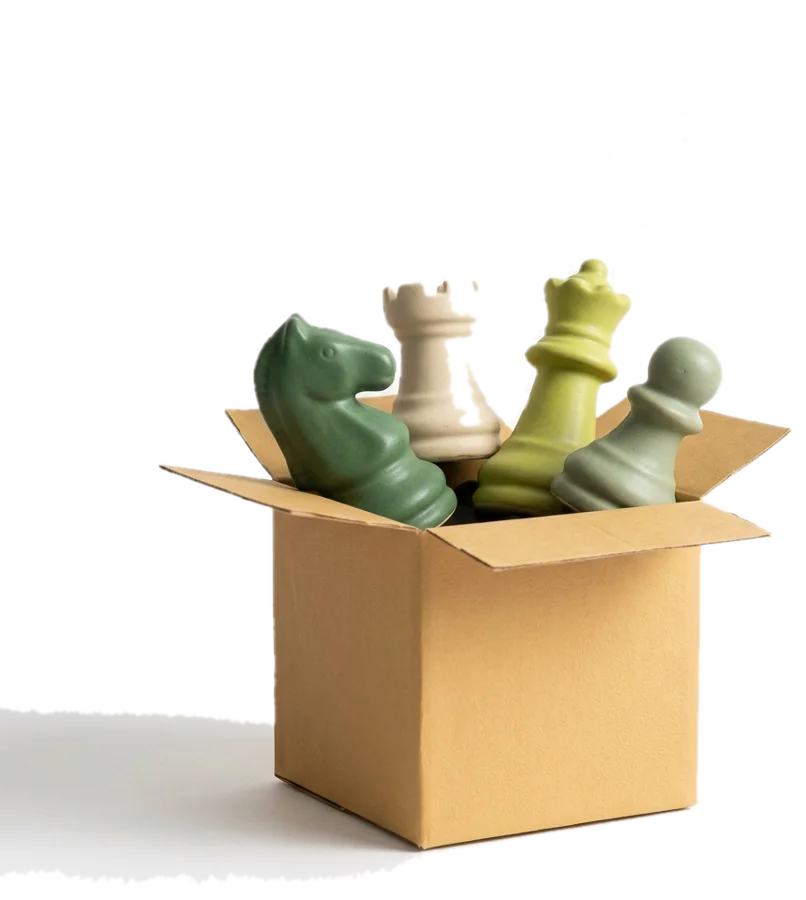 Chess pieces popping out of a box